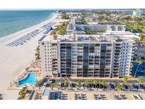 Aerial view of condo building, pool, and beach; great location at 5396 Gulf Blvd # 605, St Pete Beach, FL 33706