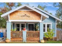 Charming bungalow with blue siding, wood accents, and a welcoming porch at 561 11Th S Ave, St Petersburg, FL 33701