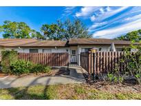 Updated condo with private fenced patio, great curb appeal at 1725 Pine Ridge E Way # E, Palm Harbor, FL 34684