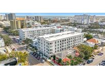 Aerial view of a modern apartment building in a vibrant city neighborhood at 644 3Rd S Ave # 302, St Petersburg, FL 33701