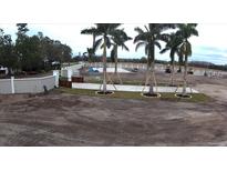 Aerial view of new construction home with landscaping underway at 8312 Cosme Rd, Odessa, FL 33556