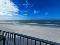 Stunning ocean view from balcony, featuring beach and blue skies at 18650 Gulf Blvd # 413, Indian Shores, FL 33785