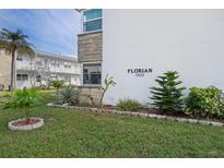 Building exterior showcasing landscaping and building number at 5855 18Th N St # 16, St Petersburg, FL 33714