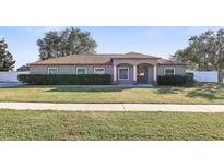 Single-story house with a landscaped lawn and neutral exterior at 6515 Clair Shore Dr, Apollo Beach, FL 33572