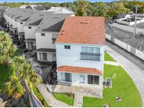 Rear view of townhome with private patio at 9406 Citrus Glen Pl, Tampa, FL 33618