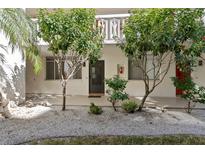 Exterior view of condo building with landscaping and individual entrances at 2630 Pearce Dr # 102, Clearwater, FL 33764
