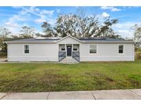 Newly built home featuring solar panels and a modern design at 902 W Alsobrook St, Plant City, FL 33563
