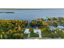 Aerial view of waterfront home with canal access and lush landscaping at 159 Danforth Dr, Punta Gorda, FL 33980