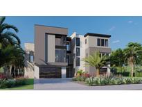 Modern three-story home with gray exterior and two-car garage at 25 Harborpointe Dr, Port Richey, FL 34668