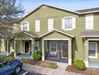 Green two-story townhome with screened porch at 2713 Lantern Hill Ave, Brandon, FL 33511