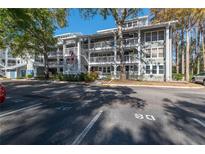 Two-story building with parking and lush landscaping at 2511 Dolly Bay Dr # 303, Palm Harbor, FL 34684