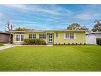Charming ranch home with a manicured lawn and updated facade at 3415 S Belcher Dr, Tampa, FL 33629
