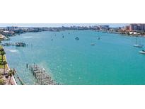 Aerial view showing waterfront property with boats at 660 Island Way # 1005, Clearwater Beach, FL 33767
