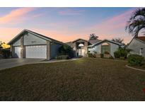 Beautiful home with a large yard and a three-car garage at 10277 Rosetti Ct, Spring Hill, FL 34608