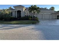 Stunning two-story home with three-car garage and manicured landscaping at 10626 Restoration Ter, Bradenton, FL 34212