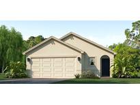 Single-story home with a two-car garage and attractive landscaping at 12016 Lansing Gln, Parrish, FL 34219