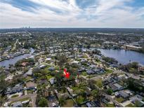 Aerial view of a single-Gathering home on a tree-lined street at 120 89Th Ne Ave, St Petersburg, FL 33702