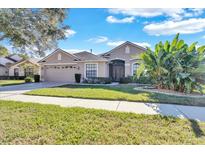 Attractive single-story house with a two-car garage at 13717 Pimberton Dr, Hudson, FL 34669