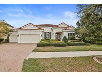 Beautiful one-story home with tile roof and lush landscaping at 11910 Climbing Fern Ave, Riverview, FL 33579