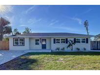 Newly renovated single story home with modern facade, new landscaping, and driveway at 1709 Marilyn Ave, Bradenton, FL 34207