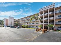 Two-story condo building with ample parking at 5980 80Th N St # 305, St Petersburg, FL 33709