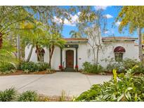 Spanish style home with lush landscaping and a large driveway at 706 15Th Ne Ave, St Petersburg, FL 33704