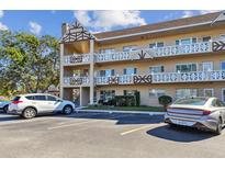 Building exterior showcasing ample parking and a well-maintained landscaping at 2311 Brisbane St # 1, Clearwater, FL 33763