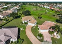 Aerial view of home on golf course community at 1943 S Pebble Beach Blvd, Sun City Center, FL 33573