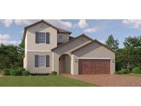 Two-story house with brown roof, beige walls, and a wooden garage door at 10843 Ibis Brook Ct, Land O Lakes, FL 34638