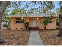 Quaint house with a walkway and mature trees at 2201 Park N St, St Petersburg, FL 33710