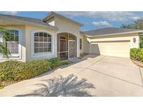 Well-maintained house with a two-car garage and landscaped front yard at 3019 124Th E Ave, Parrish, FL 34219