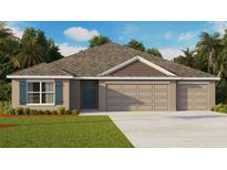 One-story home with a two-car garage and attractive landscaping at 1616 Sourwood Dr, Ruskin, FL 33570