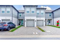 Modern townhome with 2-car garage and paved driveway at 2441 Foggy Creek Cir, Clearwater, FL 33764