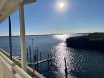 Stunning water view from balcony, showcasing the waterway and distant horizon at 8829 Bay Pointe Dr # 205, Tampa, FL 33615