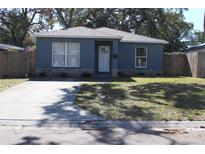 Cute bungalow with gray exterior, stone accents, and a driveway at 4684 25Th S Ave, St Petersburg, FL 33711