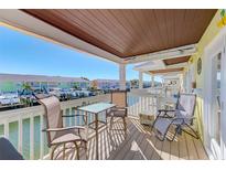 Relaxing balcony with water views and seating for two at 5116 Beach Se Dr # D, St Petersburg, FL 33705