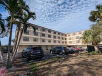 Two-story condo building with parking and landscaping at 12500 Capri Cir N # 302, Treasure Island, FL 33706