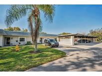Condo building with parking and landscaping at 3521 Teeside Dr # 3521, New Port Richey, FL 34655
