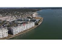 Aerial view of waterfront condo building with water access at 5900 S Shore S Blvd # 807, Gulfport, FL 33707