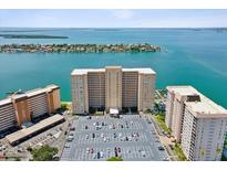 Aerial view of waterfront highrise building with parking and bay views at 5200 Brittany S Dr # 1204, St Petersburg, FL 33715