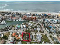 Aerial view of a house near the beach and marina at 13225 2Nd E St, Madeira Beach, FL 33708