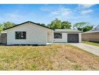 Charming single story home with a newly renovated exterior and landscaping at 6220 Westport Dr, Port Richey, FL 34668