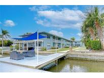 Private boat dock with seating area and waterfront access at 300 Venetian Dr # 7, Clearwater, FL 33755
