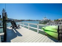 Private dock with kayak and chairs, offering waterfront access at 494 Boca Ciega Point N Blvd, St Petersburg, FL 33708