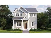 Two-story craftsman style home with gray siding, white trim, and landscaping at 744 47Th N Ave, St Petersburg, FL 33703
