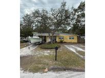 Ranch-style home with boat parking and mature landscaping at 2916 W Ellis Dr, Tampa, FL 33611