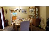 Bright dining room featuring a table, chairs, and built-in hutch at 14927 Old Pointe Rd, Tampa, FL 33613