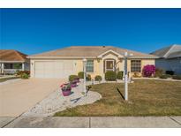 Attractive single-story home with well-maintained landscaping at 2455 E Del Webb Blvd, Sun City Center, FL 33573