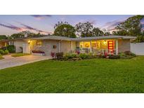 Updated home with a welcoming porch and beautiful landscaping at 7301 2Nd S Ave, St Petersburg, FL 33707