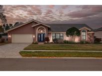 Beautiful two-story home with landscaped yard and attached garage at 1811 Stonebrook Ln, Safety Harbor, FL 34695